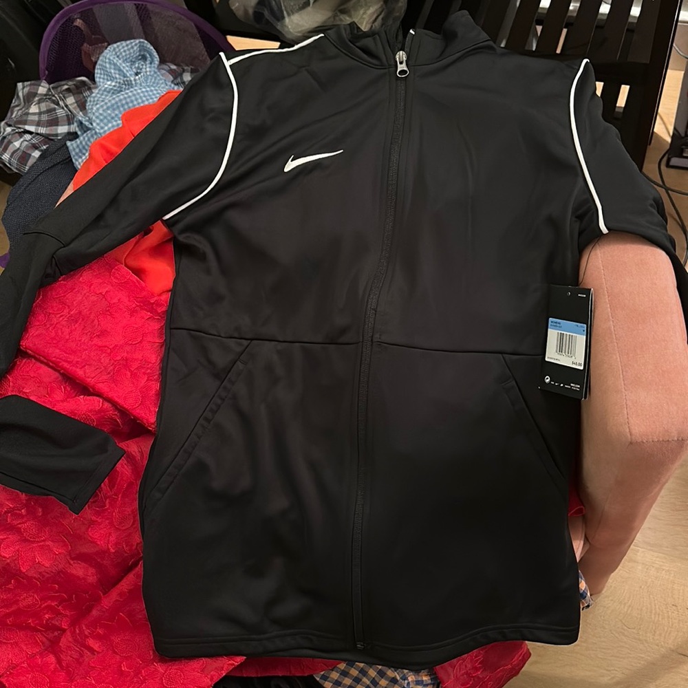 Women’s Nike dry-fit jacket. Brand new - tag still on the jacket.